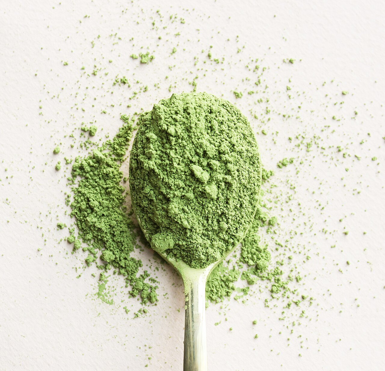 Matcha powder on a spoon